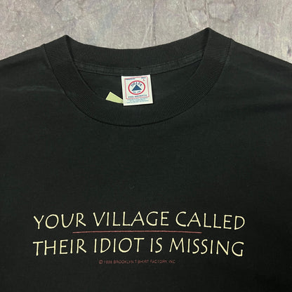 90s Black Text "Your Village Called Their Idiot Is Missing" Quote Shirt L AU97